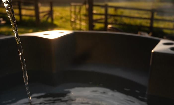 Private wood burning hot tub overlooking the farm, welcome logs provided with instructions to heat (takes 2 hours to heat perfectly)